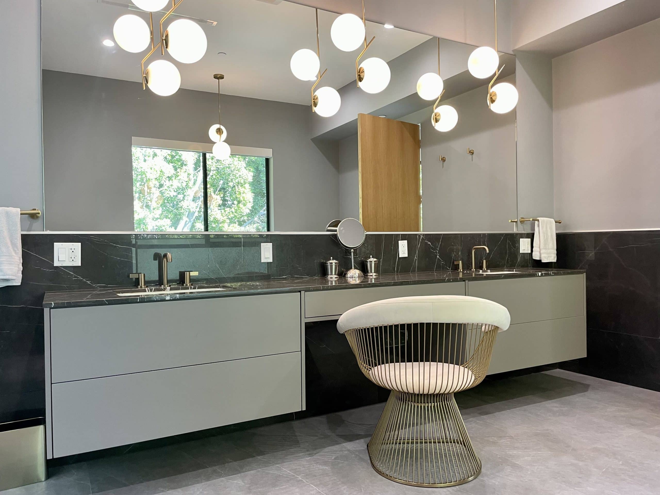 Modern chef's kitchen with statement lighting in the Beverly Hills custom home