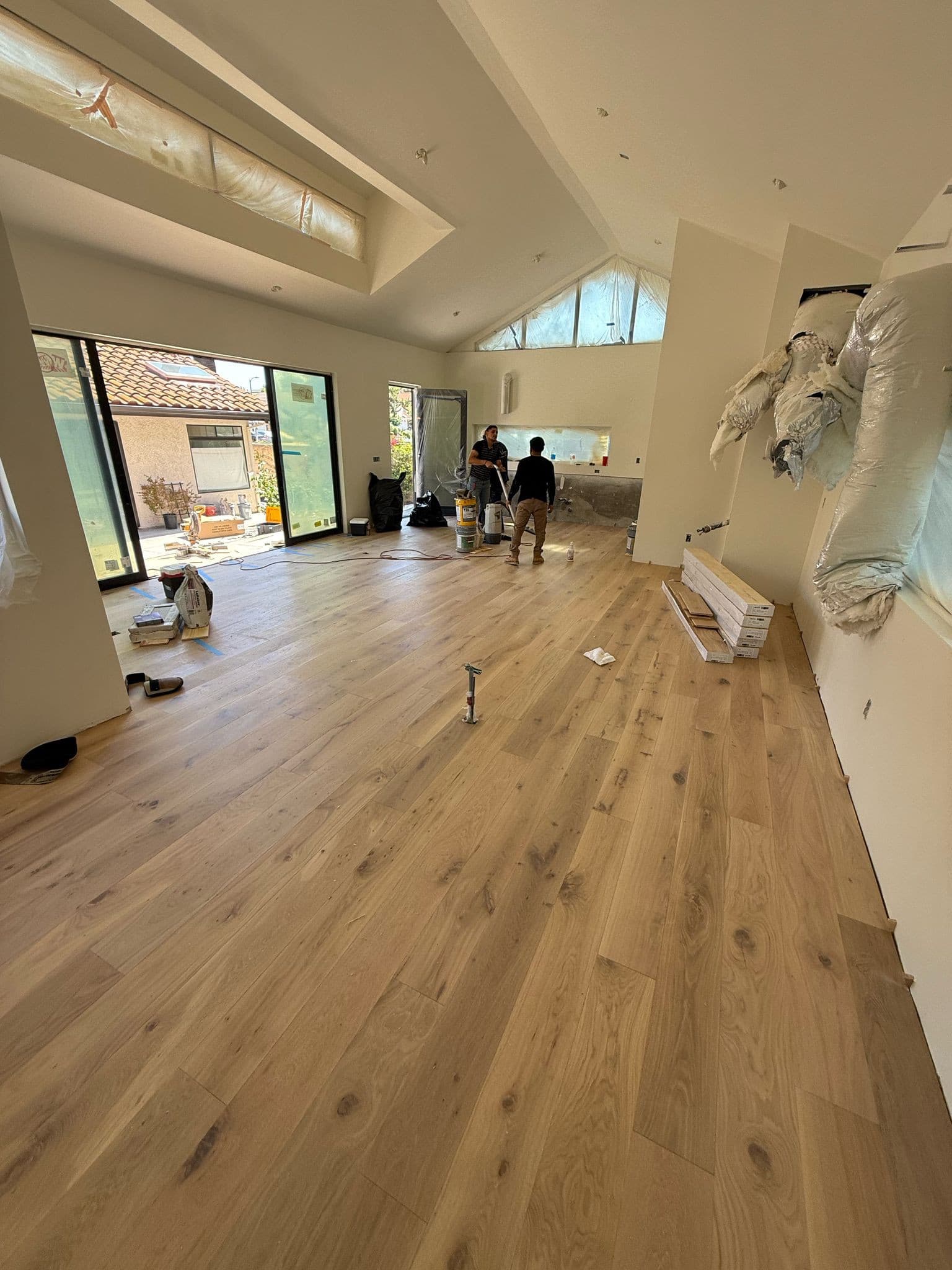 Finished modern interior with hardwood floors and glass sliders in the West Hills custom home