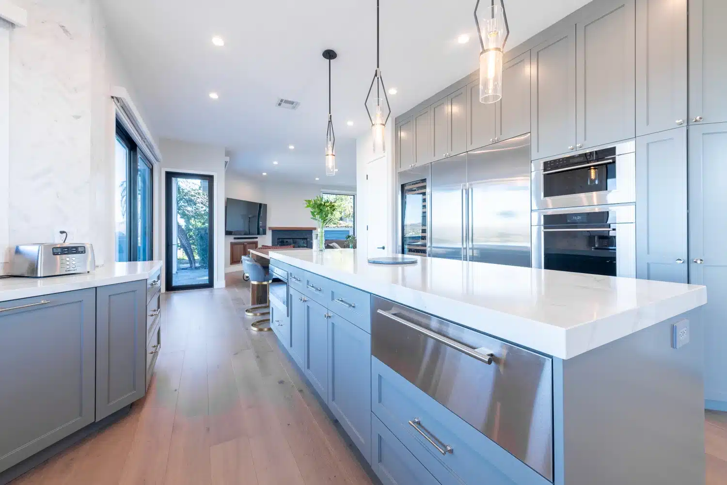Remodeled kitchen with waterfall island, custom cabinetry, and valley views