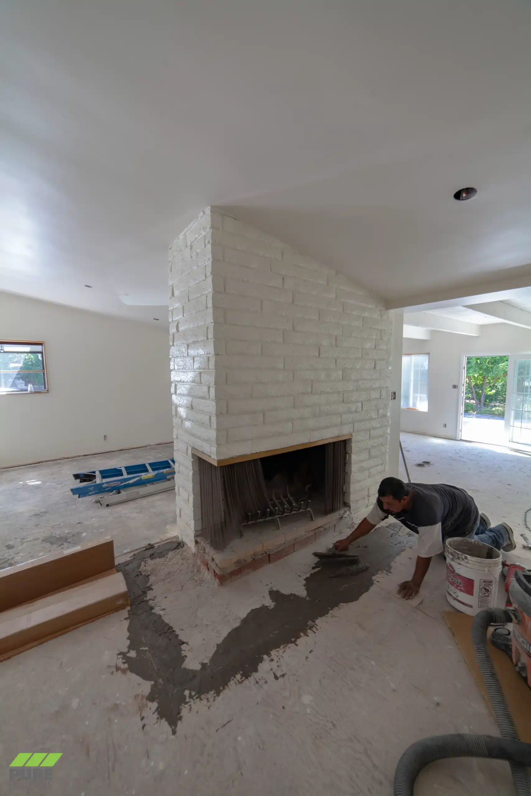 Fireplace and flooring work underway
