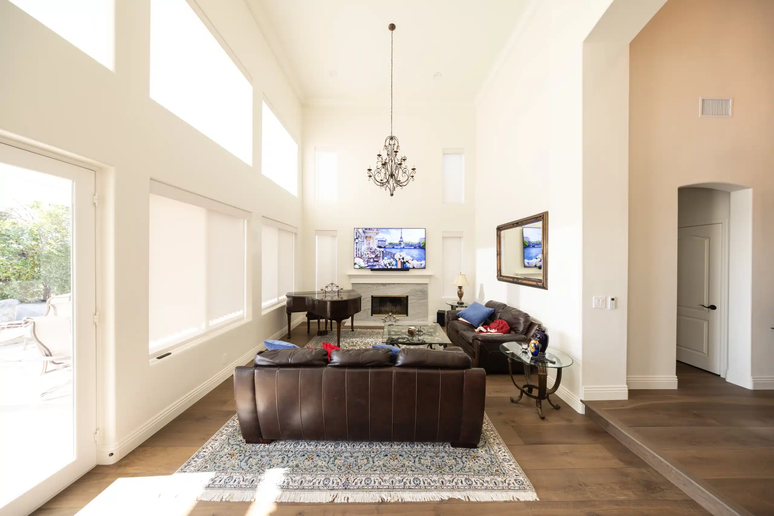 Renovated open-plan great room with vaulted ceilings and new windows