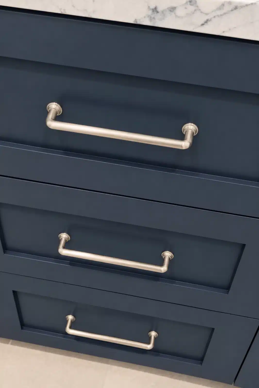 Navy vanity drawers with brushed nickel pulls